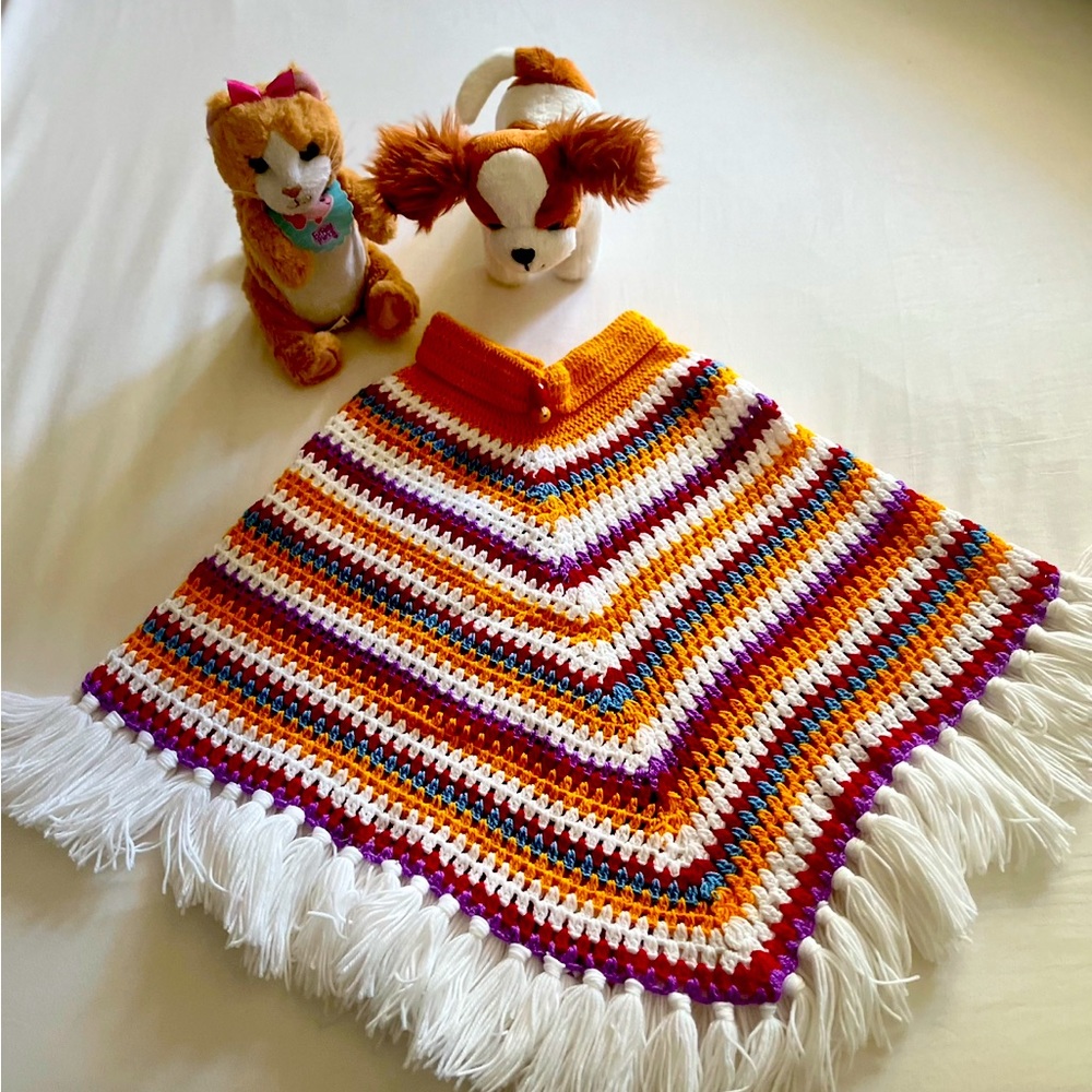 Hand knitted wool girls poncho sweater.